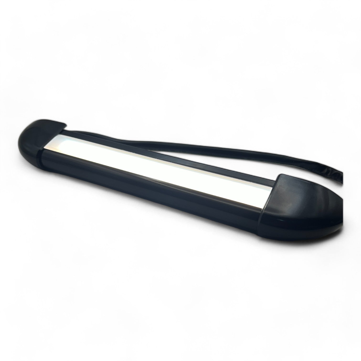 compact black 12v LED exterior light on table