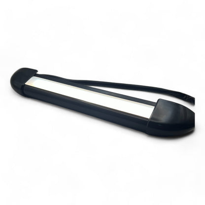 compact black 12v LED exterior light on table