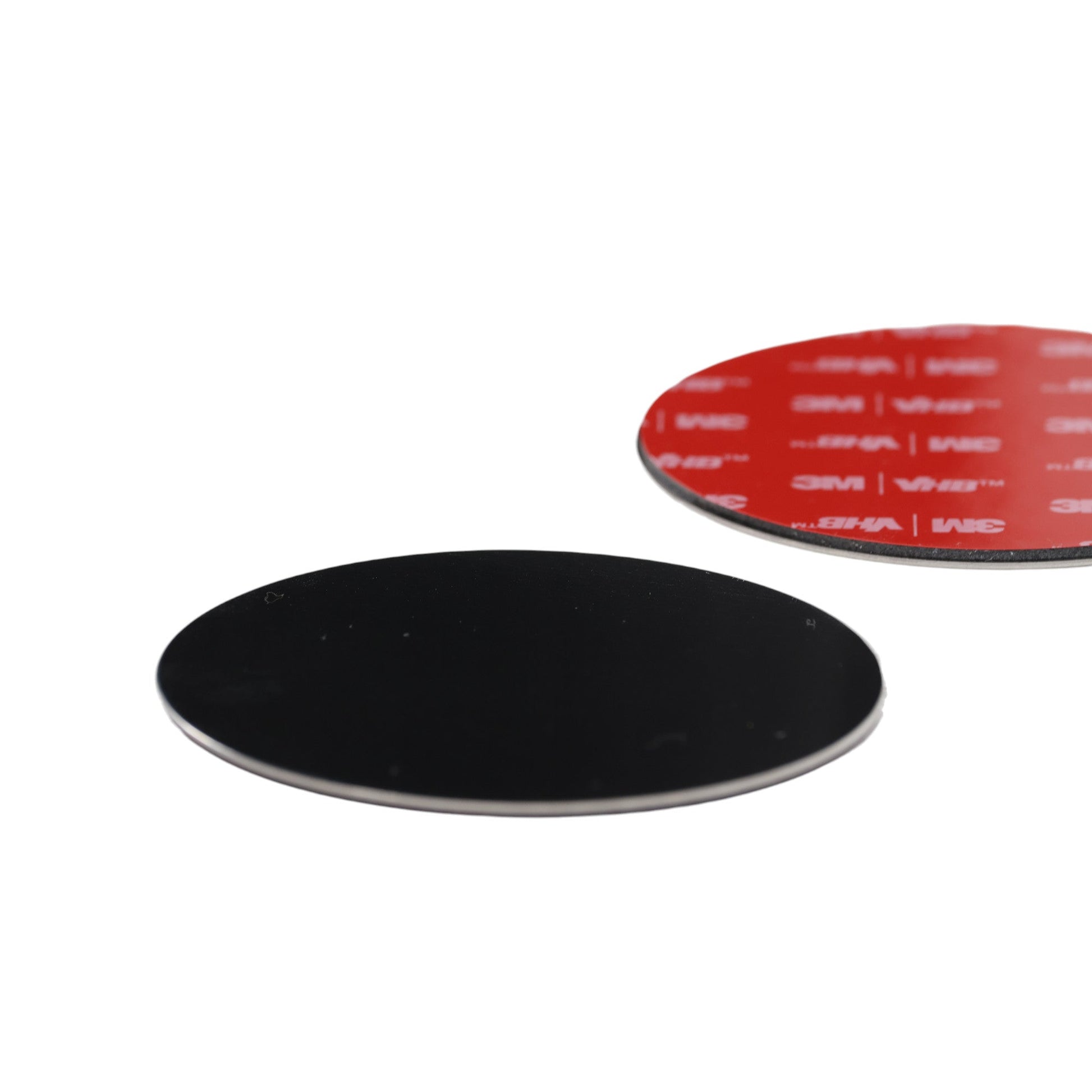 close-up of 3M adhesive metal discs with peel-off backing